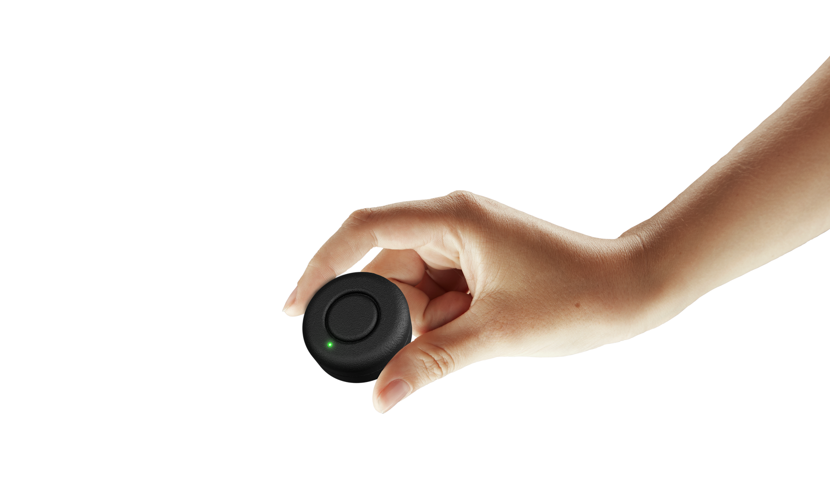 A Lodestar puck held between two fingers, showing its size